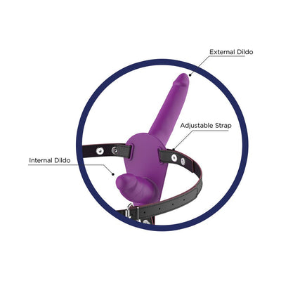Purple dual-function strap-on with adjustable black harness, featuring external and internal silicone attachments.
