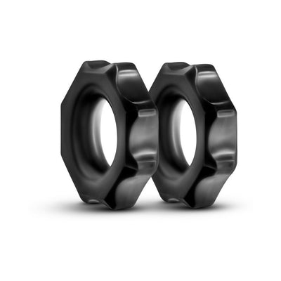 Two black hexagonal-shaped cock rings made from soft, stretchy elastomer with a smooth matte finish.