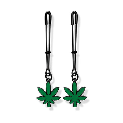 Pair of black adjustable tweezer nipple clamps with green cannabis leaf charms and removable rubber tips.