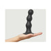Hand holding large black silicone dildo plug with three rounded beads and suction base against light background