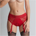 Red lace lingerie harness with adjustable garter straps and elastic waistband worn with black stockings
