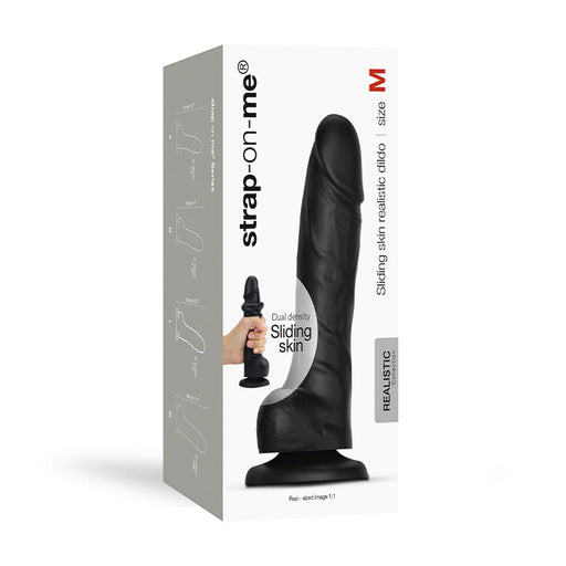 Black realistic dual-density dildo with sliding skin texture, size M, shown on product packaging with hand holding smaller version.