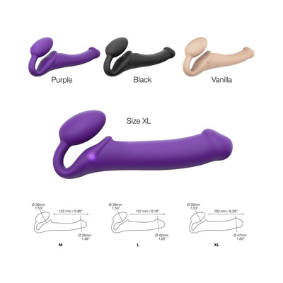 Three strap-on vibrators in purple, black, and vanilla colors, shown in XL size with size diagrams for M, L, and XL.