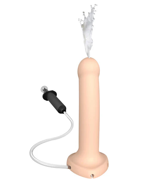 Flesh-colored silicone dildo with attached tube and syringe, demonstrating liquid ejection feature.
