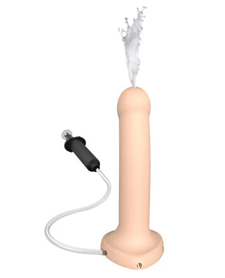 Flesh-colored silicone dildo with attached tube and syringe, demonstrating liquid ejection feature.