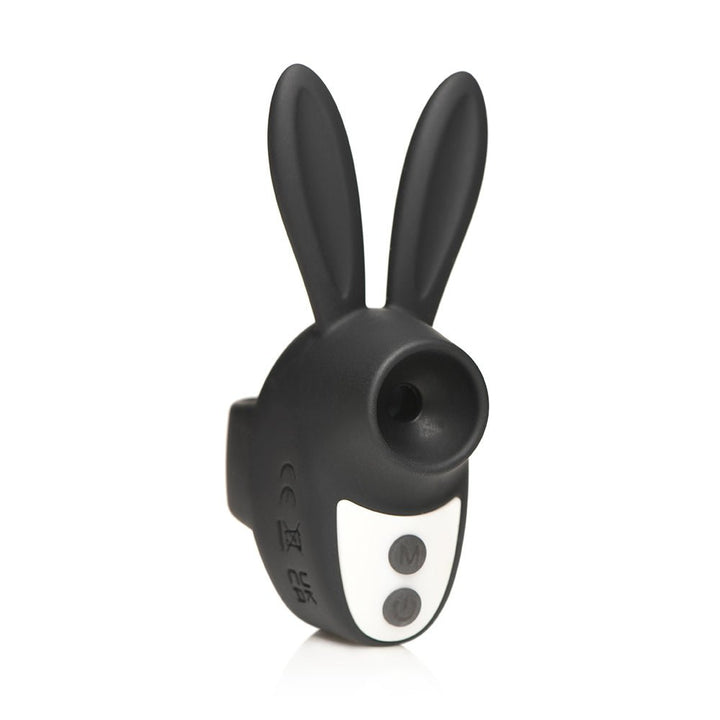 Compact black bunny-shaped clitoral stimulator with dual buttons and a suction opening, made of smooth silicone.