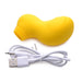 Yellow silicone clitoral stimulator with ergonomic shape and USB charging cable on white background.