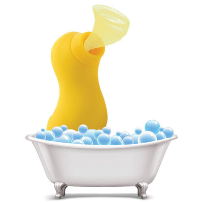 Yellow duck-shaped clitoral stimulator with suction feature sitting in a white bubble bath tub illustration.