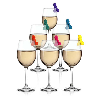 Six wine glasses with colorful playful drink markers clipped on the rims for easy identification at parties.
