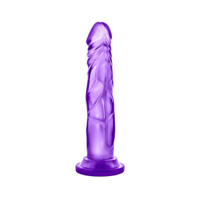 Purple translucent realistic dildo with suction cup base standing upright on white background