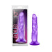 Purple realistic textured dildo with suction cup base next to its retail packaging.