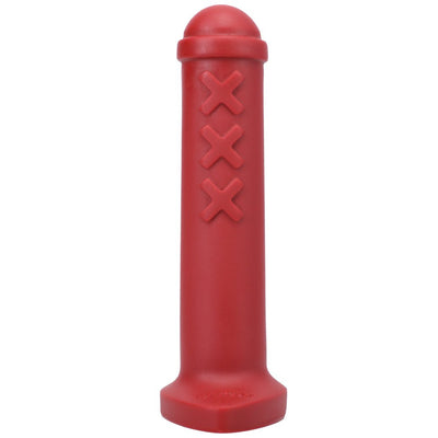 Red silicone mini toy inspired by Amsterdam traffic barriers with three raised X details and rounded top.