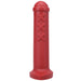 Red silicone mini toy inspired by Amsterdam traffic barriers with three raised X details and rounded top.
