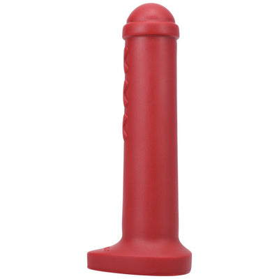 Red silicone mini toy inspired by Amsterdam traffic barriers with a rounded top and flat base.