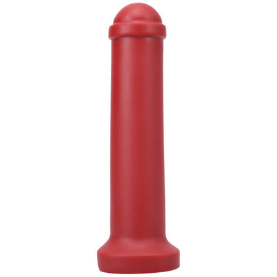 Red silicone mini toy inspired by Amsterdam traffic barriers with smooth cylindrical shape and rounded top.