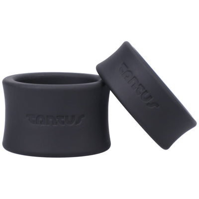 Two black silicone Tantus ball stretchers with embossed branding, shown side by side on a white background.