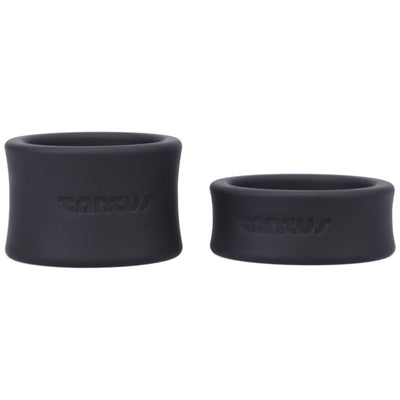 Two black silicone ball stretchers in small and large sizes with Tantus logo embossed on each.