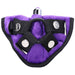 Purple velvet strap-on harness with black adjustable straps and a silver bullet vibrator inserted in the front pocket.
