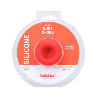 Tantus Buoy C-ring small size in red silicone displayed in clear round packaging with orange and white label.