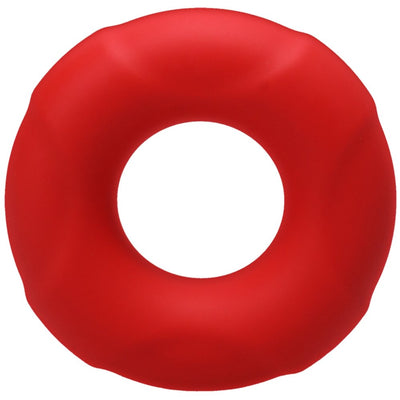 Small red soft silicone Tantus Buoy C-ring with a smooth, slightly textured surface and circular shape.
