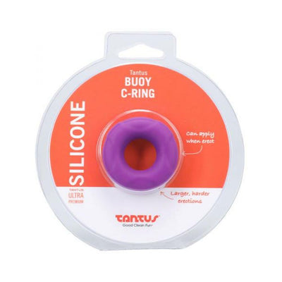 Purple Tantus Buoy C-ring in clear packaging with orange and white label, made from soft silicone for comfort and durability.
