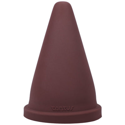 Oxblood red firm silicone cone-shaped adult toy with a wide base and Tantus logo embossed near the bottom.