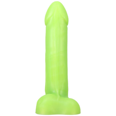 Bright green realistic silicone dildo with a flared base, standing upright on a white background.