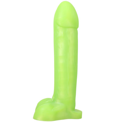 Bright green realistic silicone dildo with a sturdy base and detailed texture, standing upright on a white background.