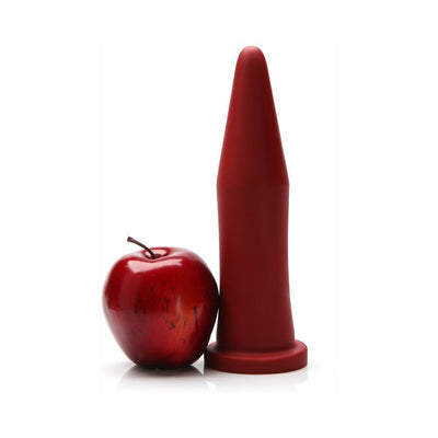 Crimson tapered silicone trainer next to a red apple for size comparison on a white background.