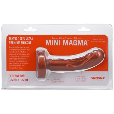 Tantus Mini Magma 5-inch firm silicone dildo with textured molten drip design in clear packaging on orange background.