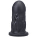 Black firm silicone dildo with a rounded tip and textured surface, standing upright on a flat base.