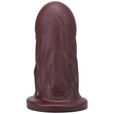 Large firm dildo in dark brown silicone with a wide base and subtle textured veins, branded Tantus Silicone.