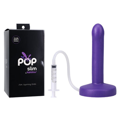 Purple slim squirting dildo with syringe and tubing next to black POP Slim by Tantus packaging box.