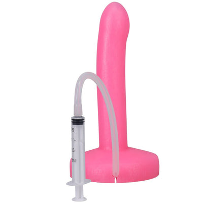 Pink slim silicone squirting dildo with attached clear syringe and tubing for fluid release.