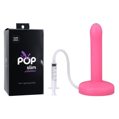 Pink slim squirting dildo with syringe and tubing next to black POP Slim by Tantus packaging box.