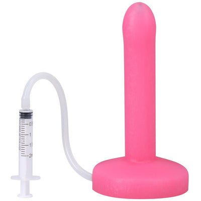 Pink slim silicone squirting dildo with attached clear syringe and tubing for fluid release.