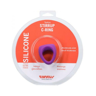 Purple silicone Tantus Stirrup C-ring in clear round packaging with orange and white label.