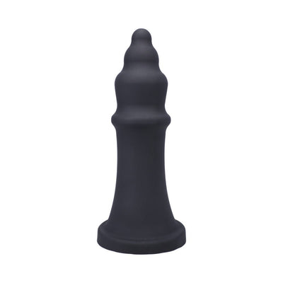 Black silicone pleasure device with tiered, textured design and wide base, standing upright on a white background.