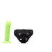 Lime green realistic dildo with black adjustable velvet strap-on harness against white background.