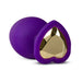 Small purple silicone anal plug with a heart-shaped gold gem base for beginner-friendly intimate play.