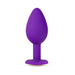 Small purple tapered silicone anal plug with flared base and gem detail, designed for beginner-friendly comfort.