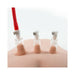 Set of three clear nipple pumping cylinders attached to skin, one connected to a red tube for suction.