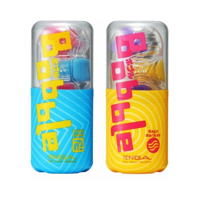 Tenga Bobble Magic Marbles and Crazy Cubes in clear cases with colorful packaging in blue and yellow.