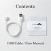 USB charging cable and user manual for the Tenga Iroha Temari Mizu pleasure device on a white background.