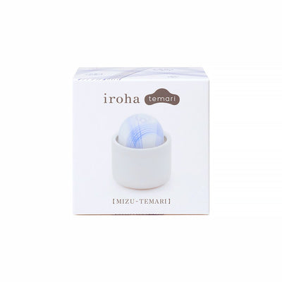 Tenga Iroha Temari Mizu in white packaging with blue patterned spherical device in a matching holder.