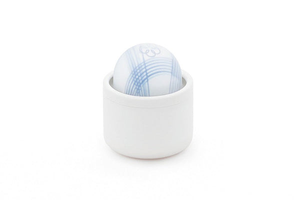 Compact white and blue Tenga Iroha Temari Mizu device with a smooth, rounded design in a white holder.