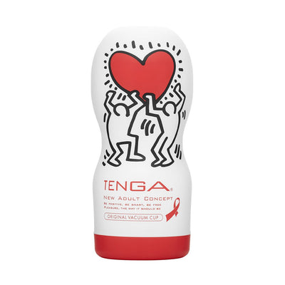 Tenga Original Vacuum Cup with Keith Haring artwork featuring two figures holding a red heart on white and red packaging.