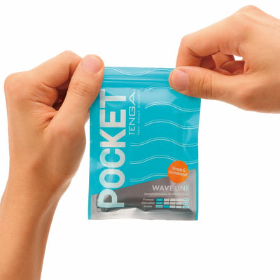 Hands holding a sealed blue package of Tenga Pocket Masturbator Sleeve Wavy Line with wave design and product details visible.