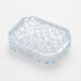 Clear textured Tenga Uni sleeve insert with raised pyramid pattern for enhanced sensation.
