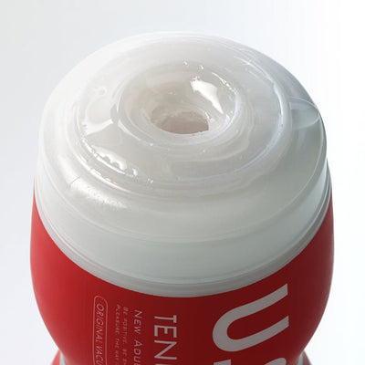 Close-up of Tenga U.s. Original Vacuum Cup showing the soft, translucent insertion sleeve and red outer casing.